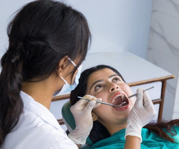 asian-dentist-checking-up-her-patient-female-dentist-female-patient-hospital_723123-1859